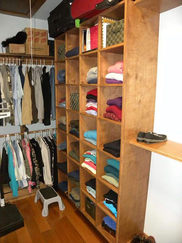 Custom designed closet space with wooden shelving