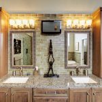 picture of bathroom vanity with stone counter tops and two sinks