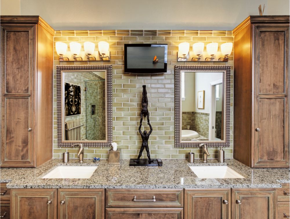 picture of bathroom vanity with stone counter tops and two sinks